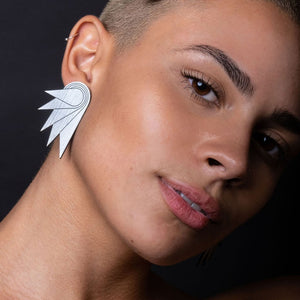 Person wearing Australian handmade Maine and Mara art deco silver SPREAD YOUR WINGS STUDS