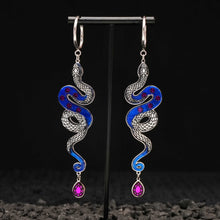Load image into Gallery viewer, silver snake hoop earrings with purple gemstones and blue marble handmade on black background