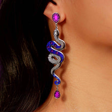 Load image into Gallery viewer, snake earring with purple gemstones worn by a person