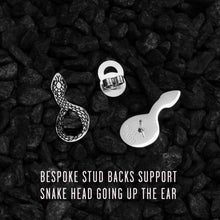 Load image into Gallery viewer, Silver Snake earrings on black pebbles with text about bespoke stud backs.