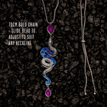 Load image into Gallery viewer, Necklace with snake design and adjustable chain on a dark textured background
