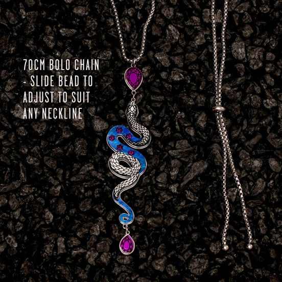 Necklace with snake design and adjustable chain on a dark textured background
