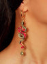 red and gold year of the snake gold hoop earrings on models ear
