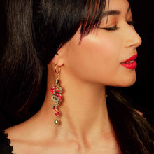 Load image into Gallery viewer, red and gold year of the snake gold hoop earrings worn y model with drak hair and red lipstick