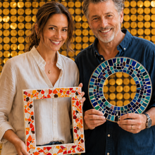 Load image into Gallery viewer, A man and a woman stand smiling in front of a gold sequin backdrop, each holding a mosaic tile frame. The woman holds a rectangular frame with orange, red, yellow, and white tiles, and the man holds a circular frame with blue, green, and white tiles.