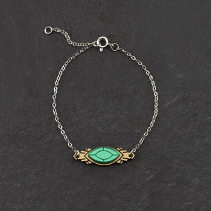 Handmade Maine and Mara ATHENA Silver Art Deco Bracelet displayed in emerald green