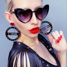 Load image into Gallery viewer, Person With Bold Sunglasses Wearing Customisable Maine And Mara GRANDE CROWN JEWEL Rainbow Black Pride Hoop Earrings