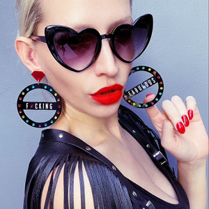 Person With Bold Sunglasses Wearing Customisable Maine And Mara GRANDE CROWN JEWEL Rainbow Black Pride Hoop Earrings