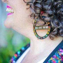 Load image into Gallery viewer, Person Wearing Maine And Mara Handmade Meaningful ROCK WHAT YOU GOT Rainbow Black Pride Hoop Earrings