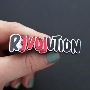 Person holding LOVE REVOLUTION Statement Brooch handmade by Maine and Mara