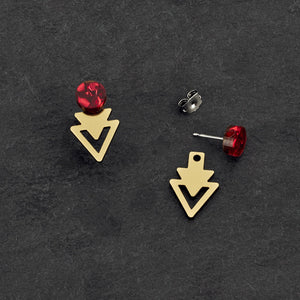 Individual pieces of Australian-made Arrow Jacket Mini Studs in ruby and gold by Maine and Mara