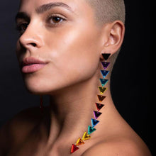 Load image into Gallery viewer, Person wearing large GET DOWN Pride Rainbow Triangle Dangle Statement Earrings handmade by Maine and Mara