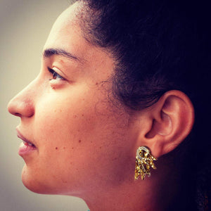 Person wearing Australian Handmade Maine and Mara gold GLITTERY SPREAD YOUR WINGS MINI statement STUDS