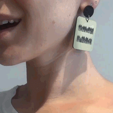 Load image into Gallery viewer, Person wearing handmade Maine and Mara EQUALITY DANGLES Statement Earrings in Gold