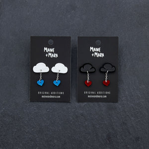 Various Colours Of The LOVE RAINDROPS Cloud and Heart Earrings by Maine and Mara shown with packaging
