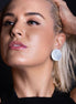 Handmade Maine and Mara Silver PLUS SIDE OVERSIZED Statement Studs worn by person
