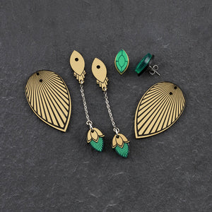 THE ATHENA emerald green gem and gold Earrings by Maine and Mara displayed in individual pieces with jackets