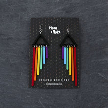 Load image into Gallery viewer, Pride RAINBOW CHEEKY CHIMES Lightweight Statement earrings with hooks on packaging by Maine and Mara