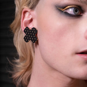 Closeup Of Australian Handmade Genderless Maine And Mara Large Black BISOUS KISS Statement Studs worn By Person