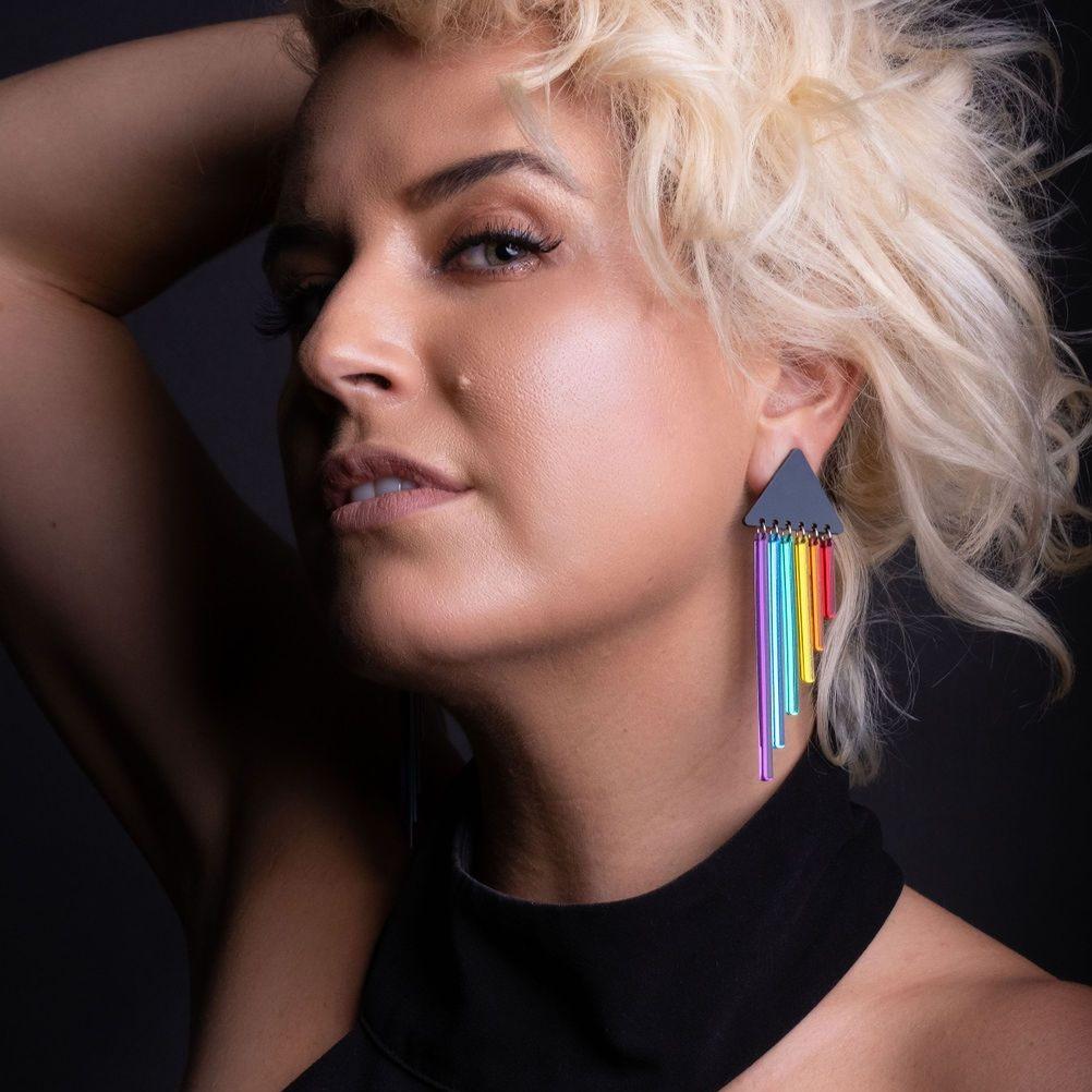 Person wearing pride RAINBOW CHEEKY CHIMES Lightweight Statement Studs handmade by Maine and Mara