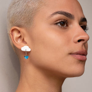 Person wearing White and blue LOVE RAINDROPS Cloud and Heart Earrings by Maine and Mara